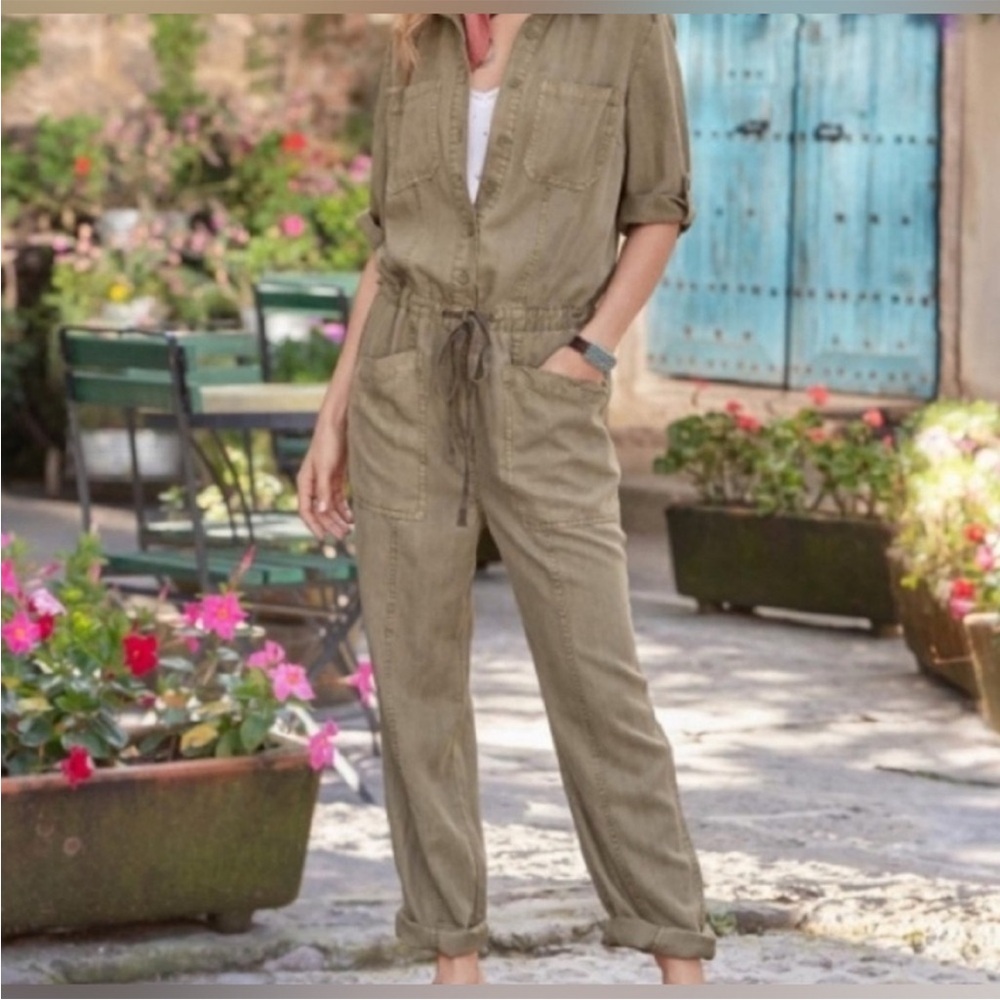 Utility Jumpsuit with drawstring waist and adjustable sleeves.